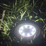 Kép 6/6 - 12 db napelemes lámpa a kertbe földbe szúrható kerek 12 cm-es átmérő 8 LED/lámpa